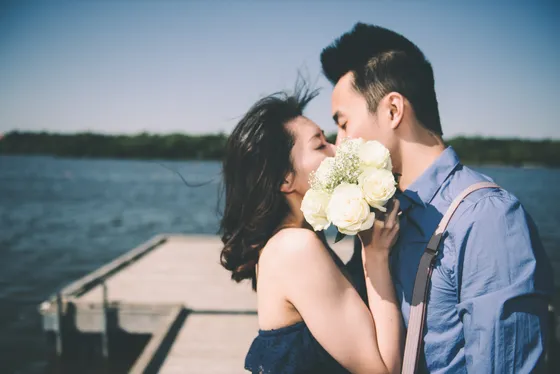 Couple walking hand in hand during engagement session