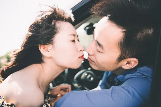Romantic kiss during golden hour engagement shoot