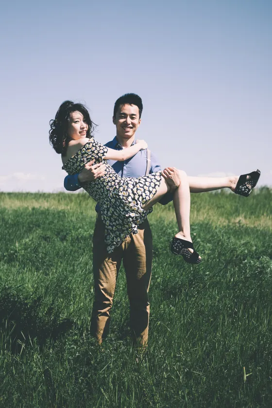 Candid laughter between engaged couple