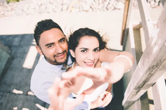 Couple walking hand in hand during engagement session