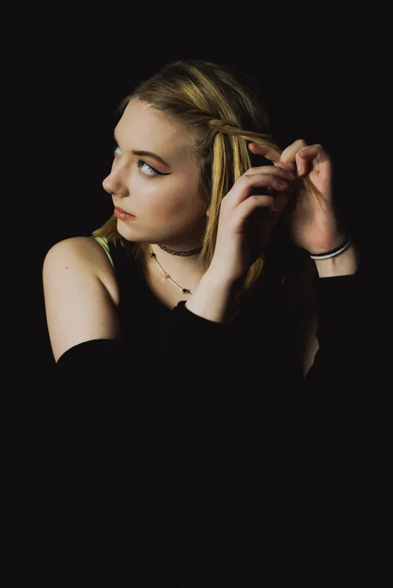 Black and white studio portrait with contrast